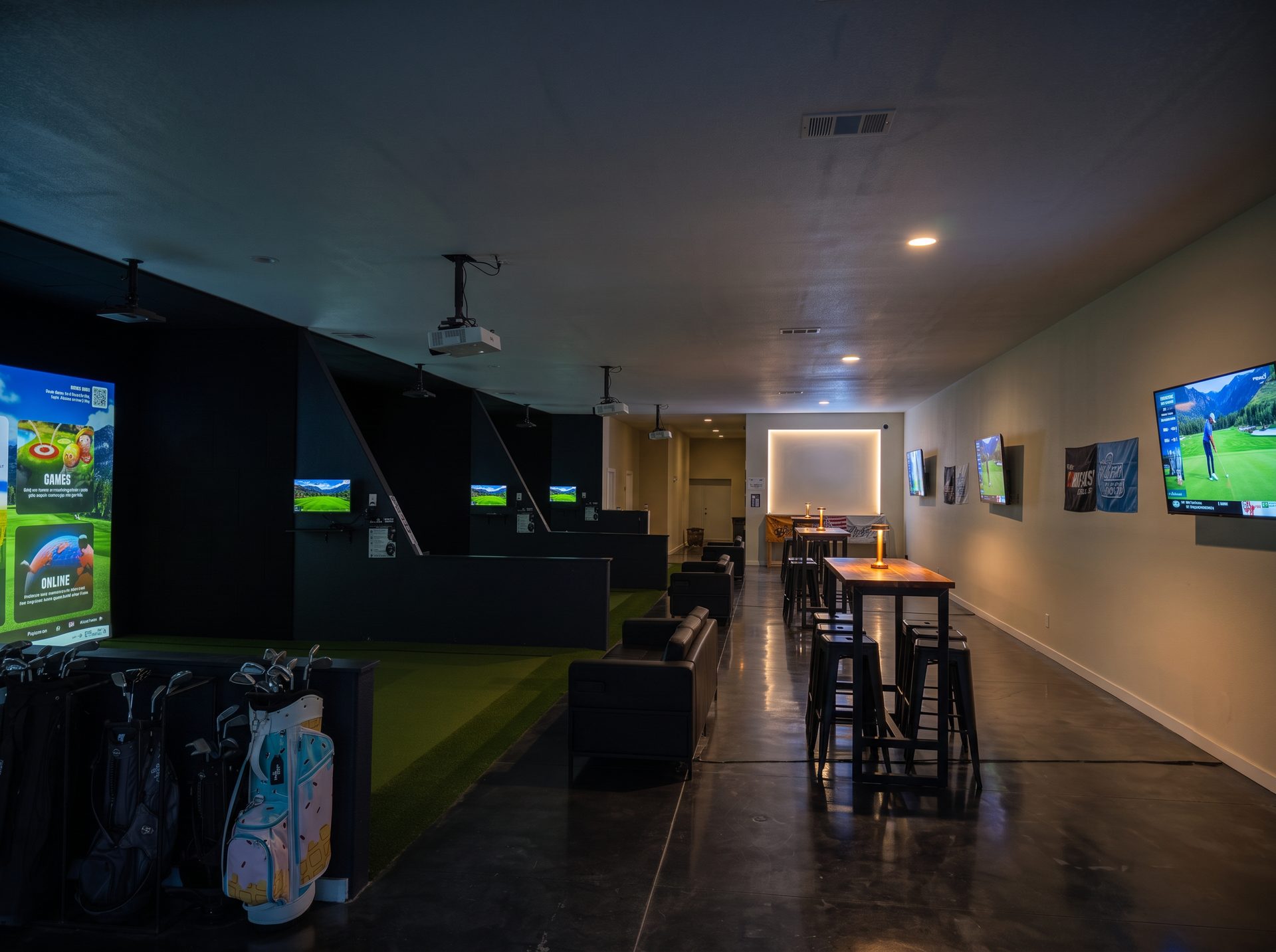 A golfer playing in a simulator bay at The Virtual Tee